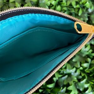 New small black clutch or bag insert for storage.